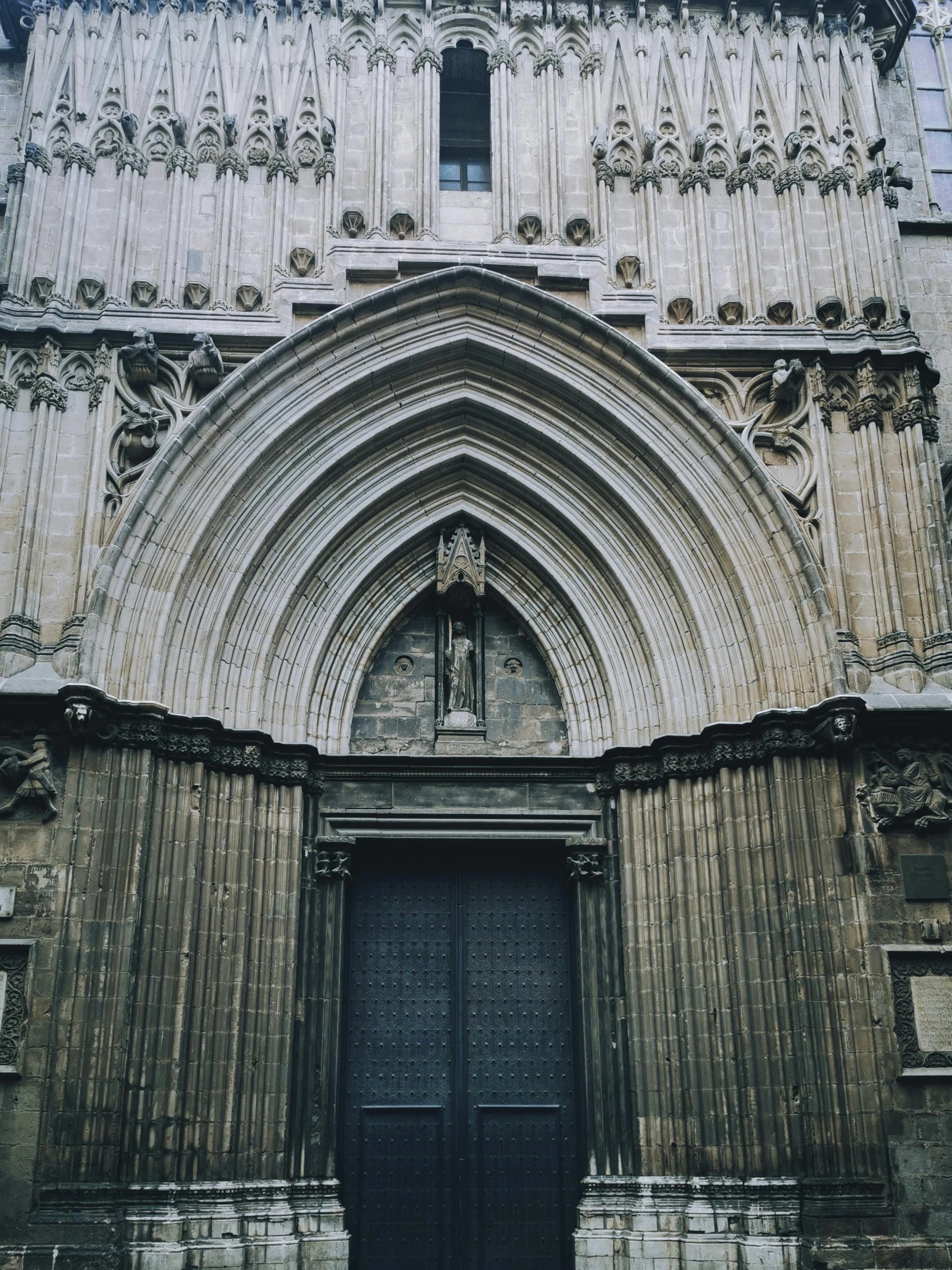 a cathedral doorway with an arch over it