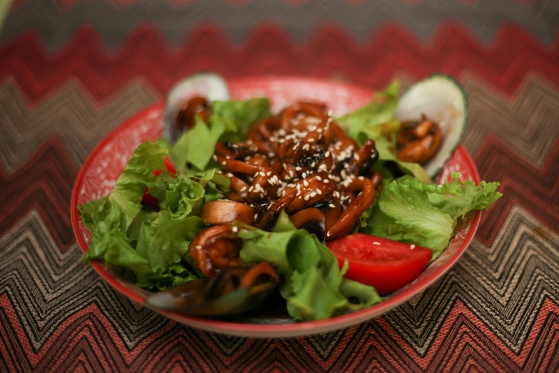 a plate with salad and a fork on it