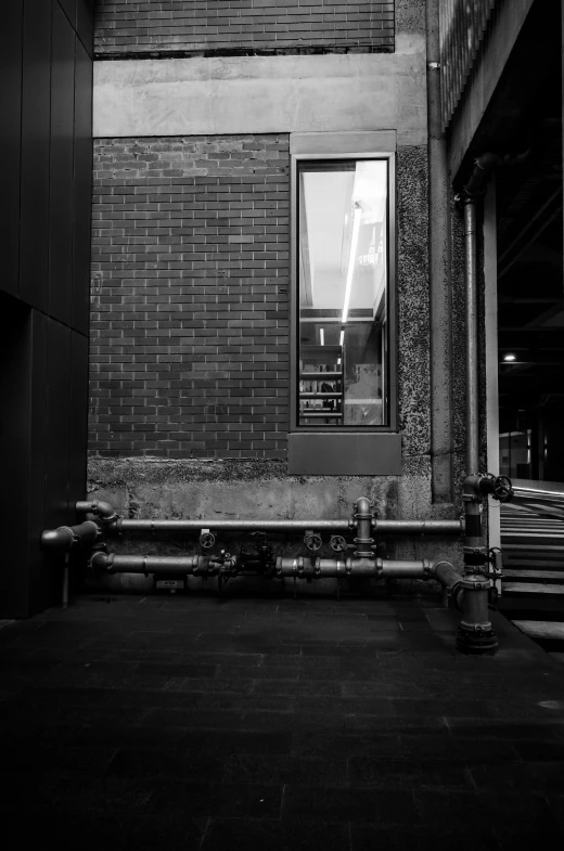 the corner of an empty building in a black and white image