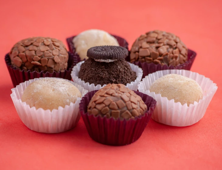 a table with five different types of cookies