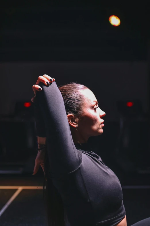 a woman is doing yoga while staring into the distance