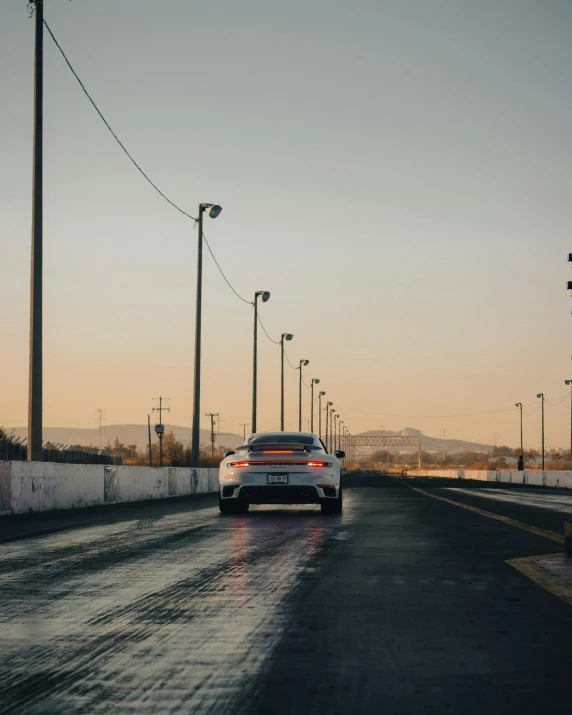 the back end of a car on a rainy highway