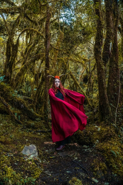 a person in a costume standing near some trees