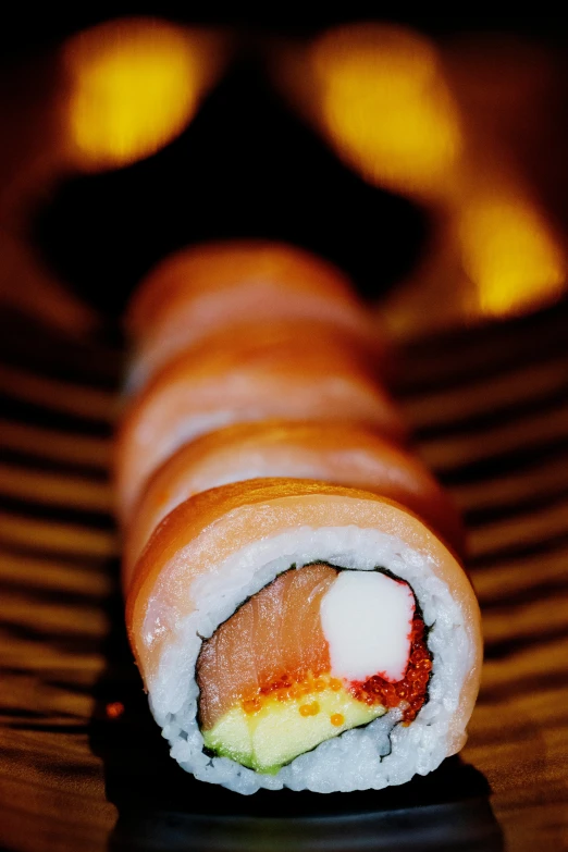 close up of a roll shaped like a sushi