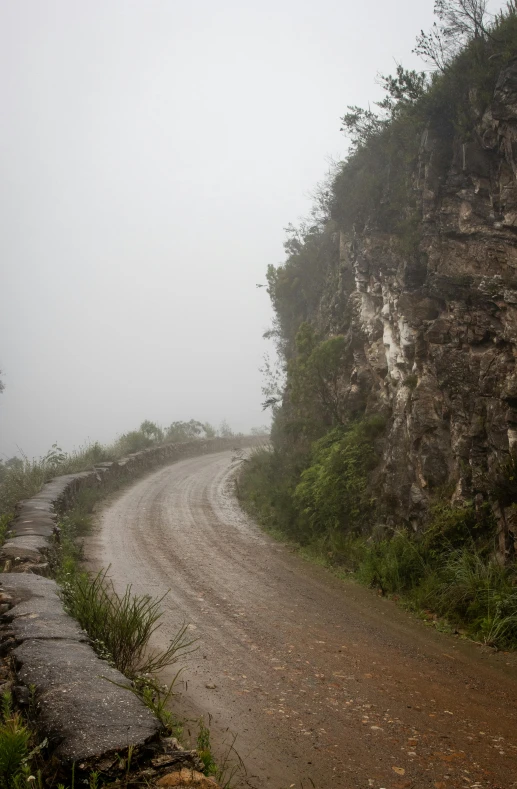 a person riding a bike on a dirt road