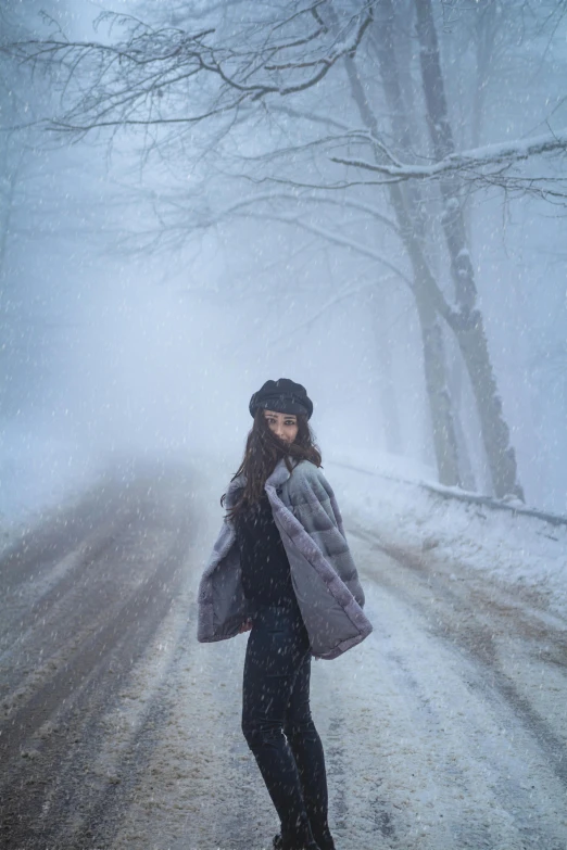 a person wearing skis standing on the road