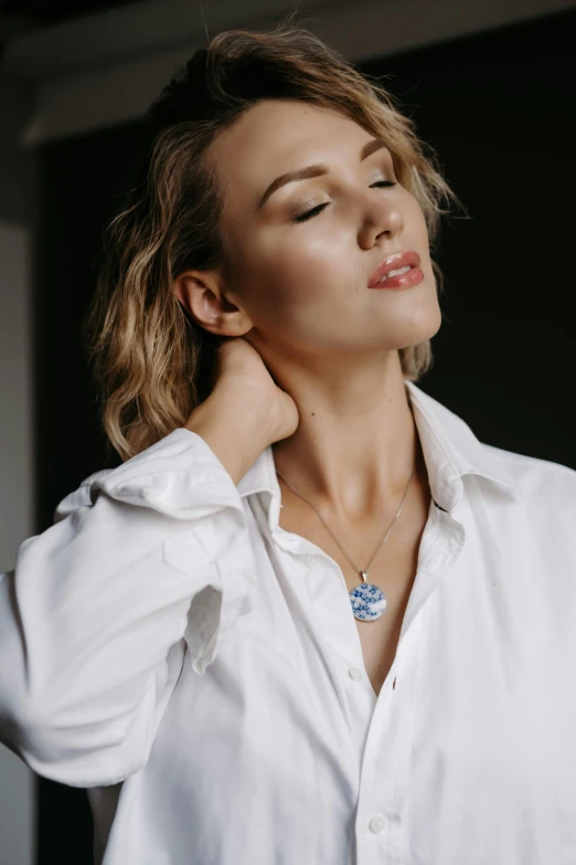 woman wearing a necklace with blue flowers on it