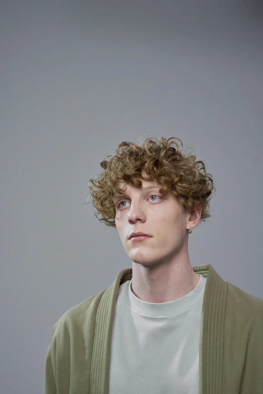 a close up view of a person with curly hair