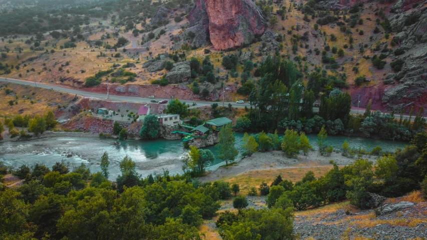 there is a mountain scene and a road going across