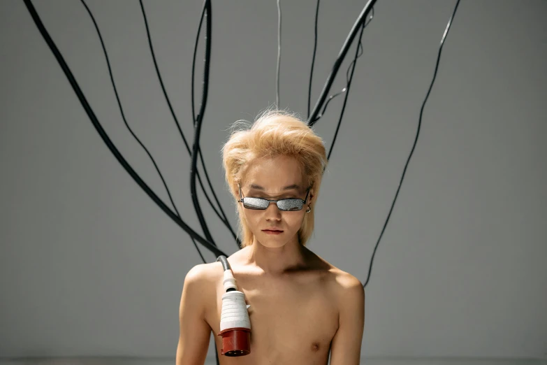 a woman with fake hair and sunglasses wearing an apple bottle