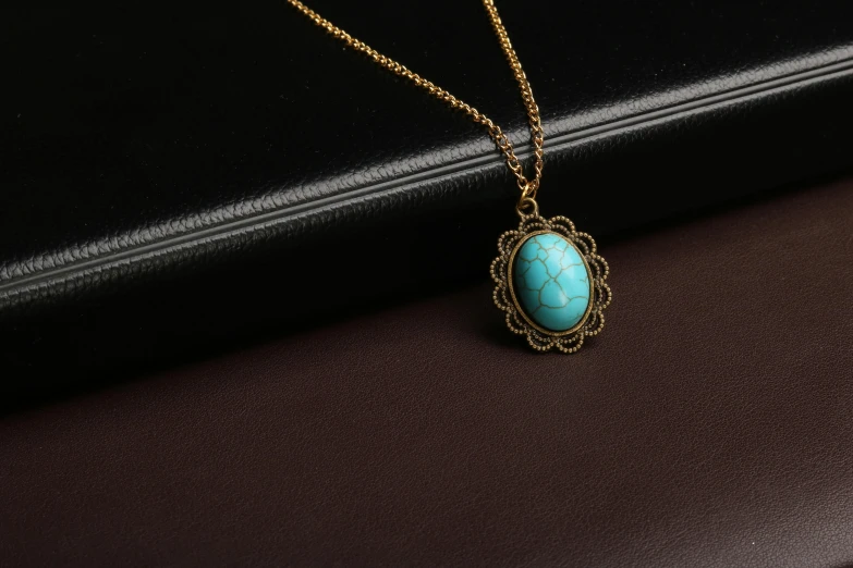 a necklace made from a turquoise colored stone