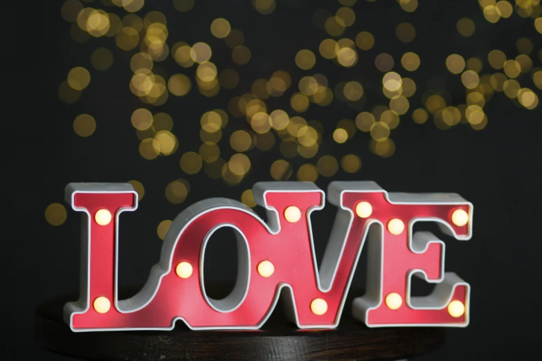 a love light sign with lights around it