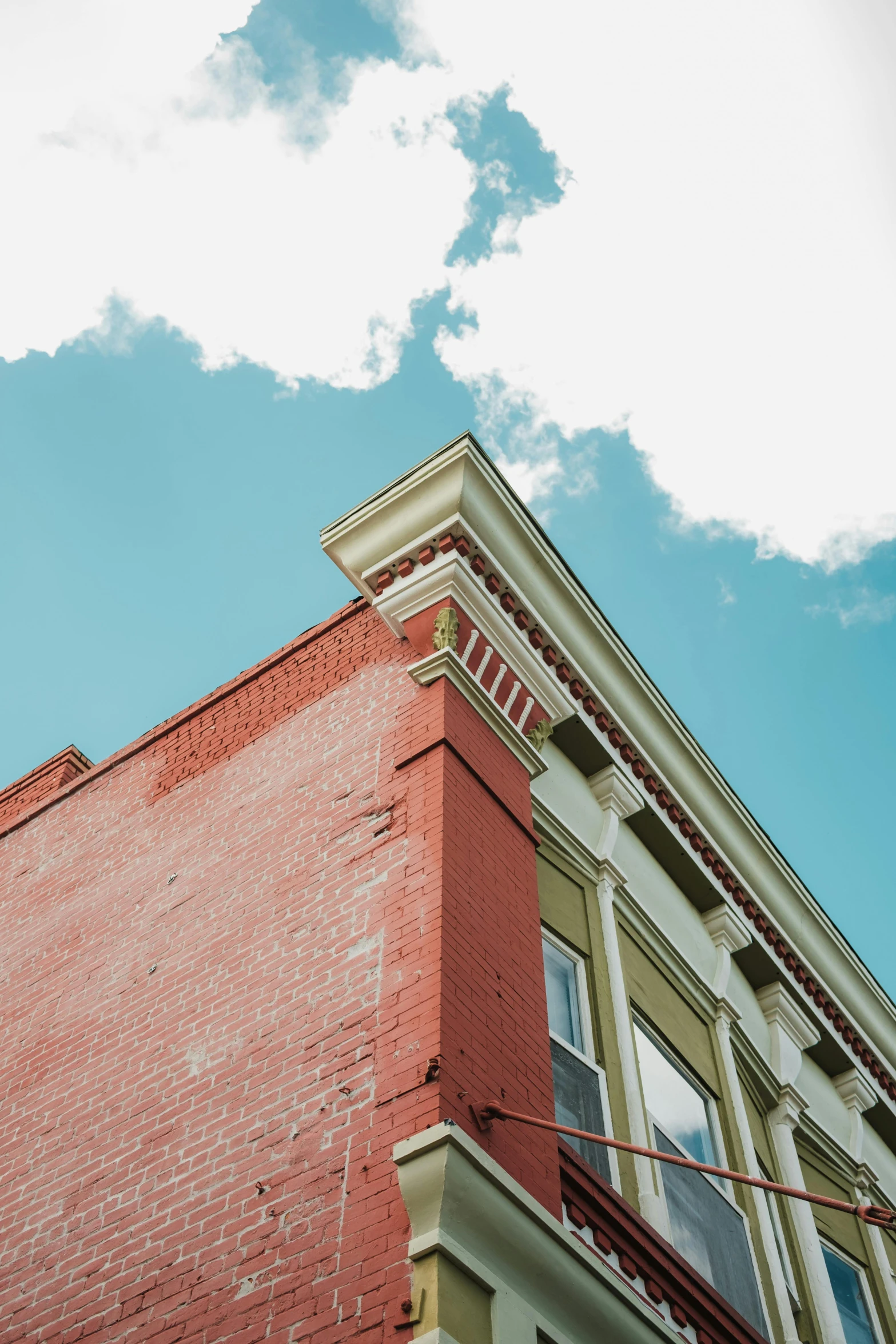 a building with many windows and the sky above it