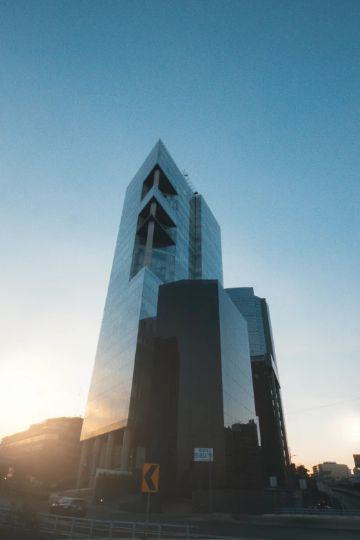 the building is reflecting in a glass windows