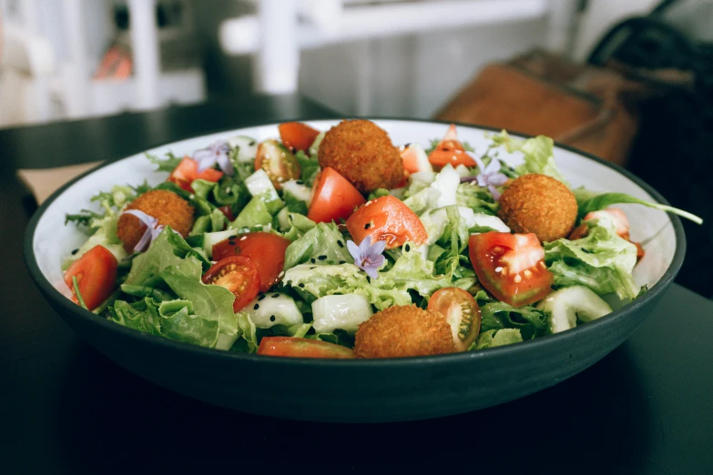 a bowl full of food sitting on a table