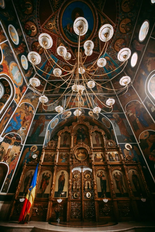 a very ornate looking church with paintings on the wall