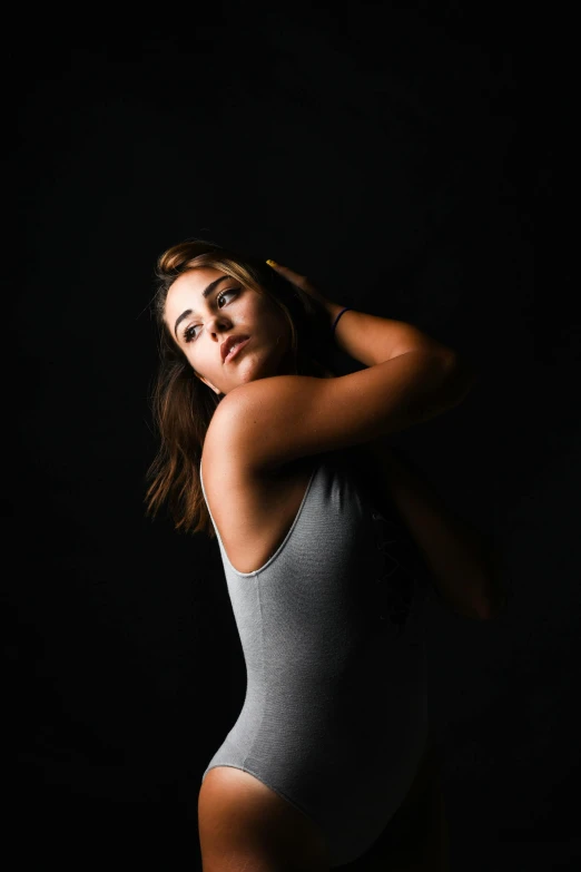 an overweight woman poses in her underwear