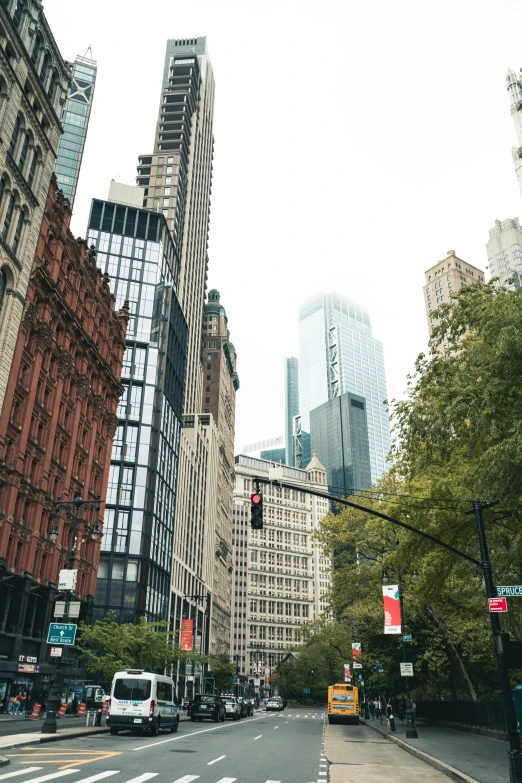 a couple of tall buildings sitting on the side of a road