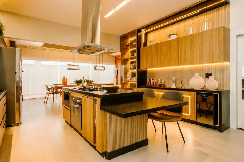 a kitchen has a large counter, appliances and cabinets