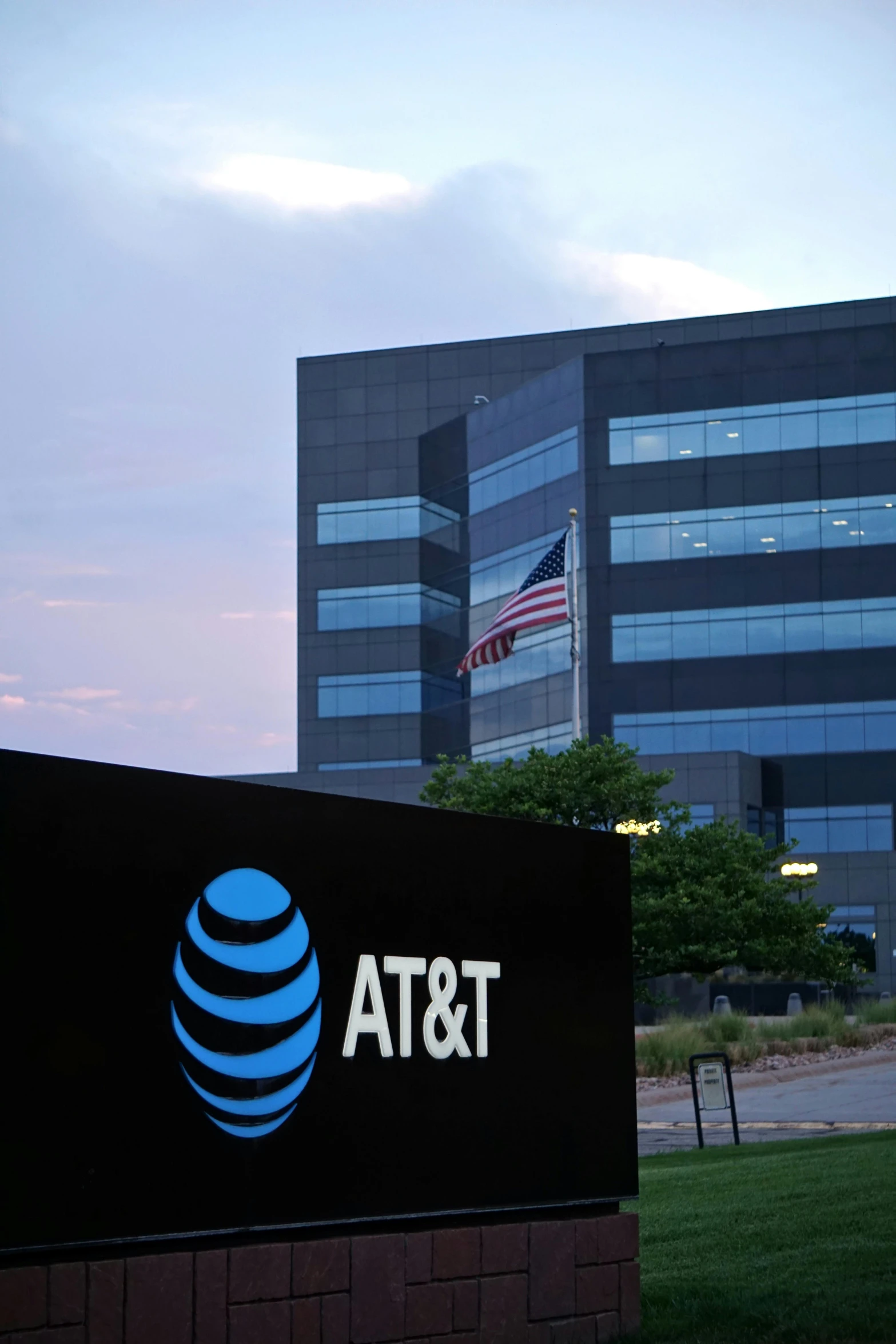 the at & t building and grassy field in front of it