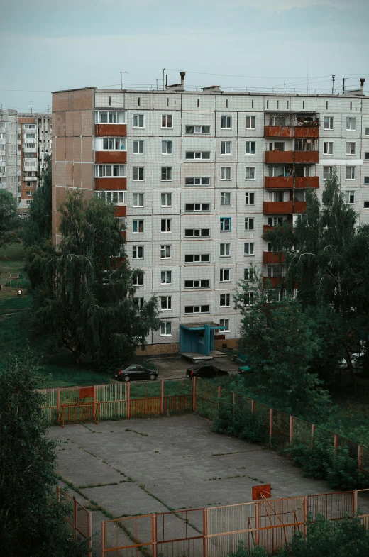 an empty building surrounded by a park