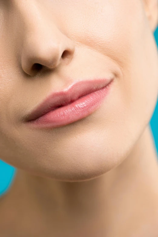 woman's face with close up of lip looking up