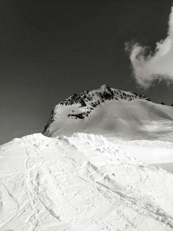 a person is snowboarding down the mountain