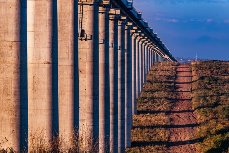 some very big concrete pipes on the side of the road