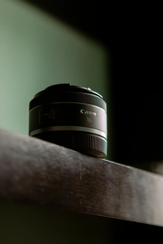 a close up of a camera lens on a shelf