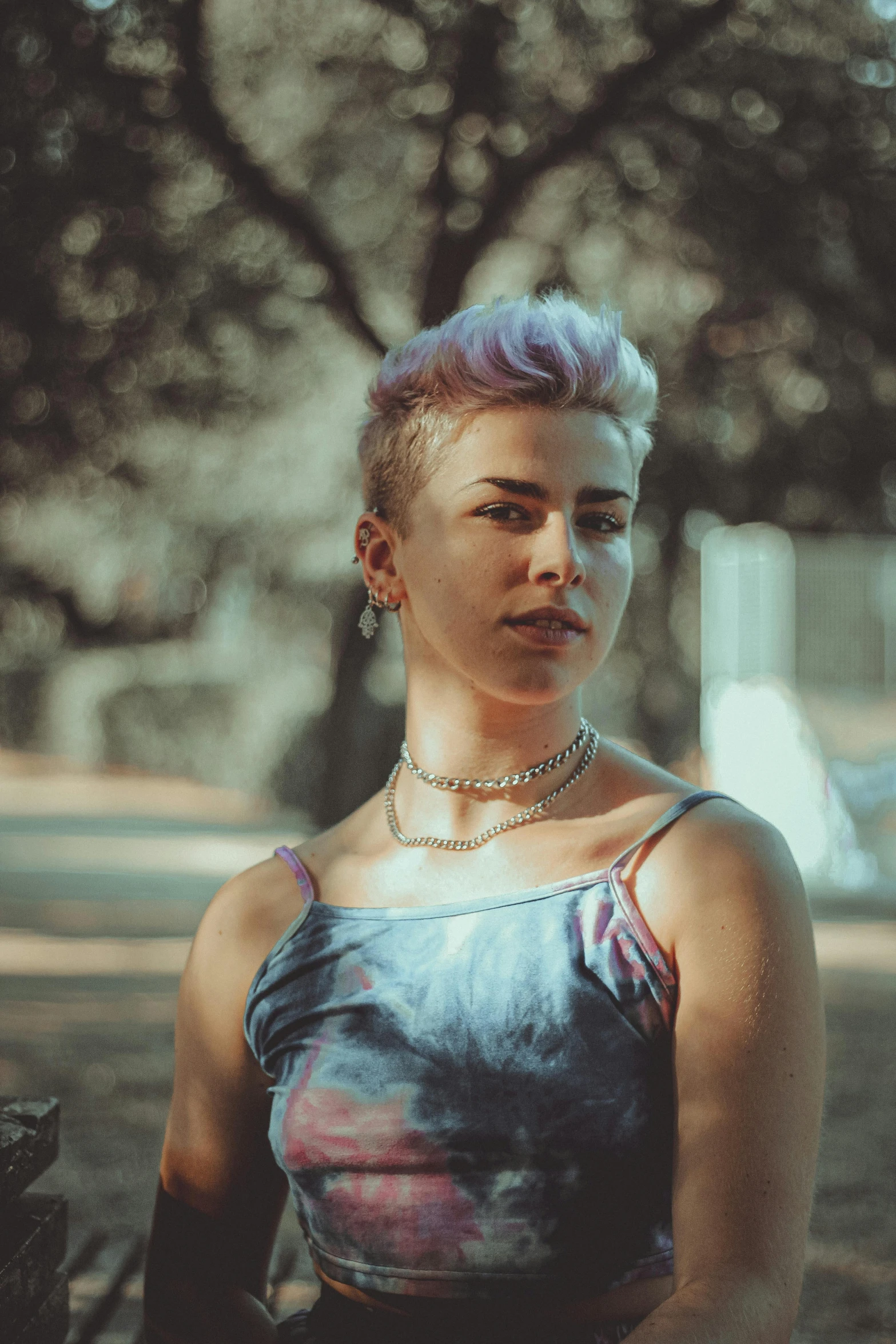 a girl with purple hair in the outdoors