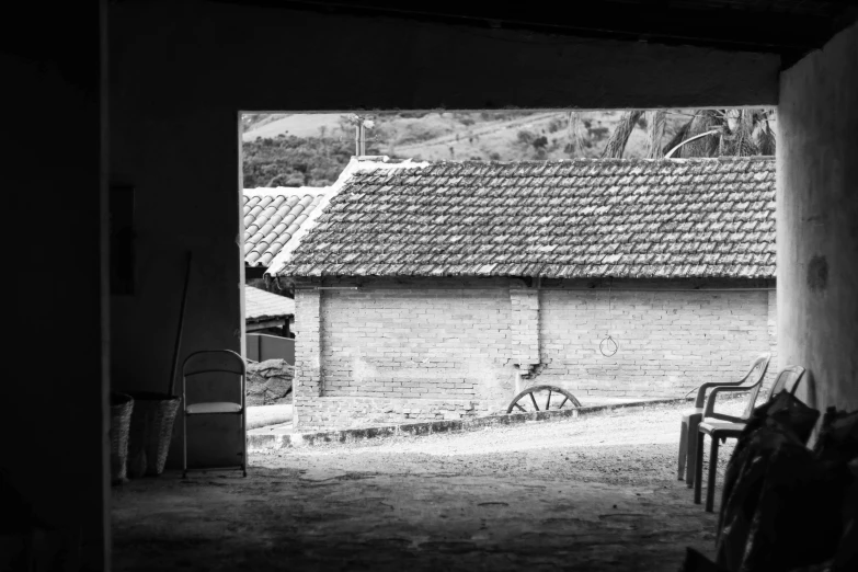 a room with a door that leads into a barn