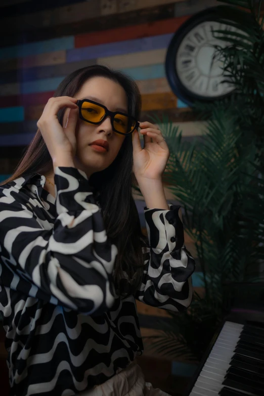 a woman wearing sunglasses in a striped top