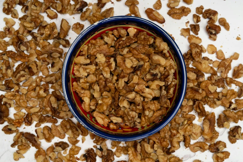 a bowl of nuts are sitting on a table