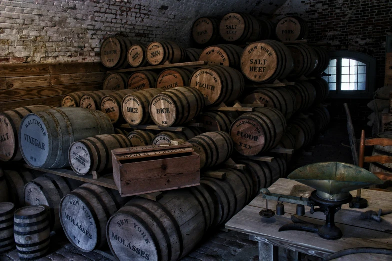 many barrels are stacked near one another