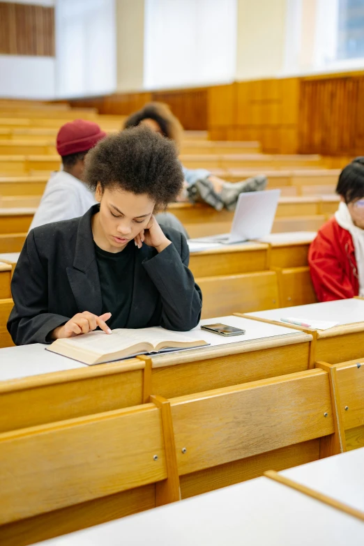 people sit at the tables in a lecture hall