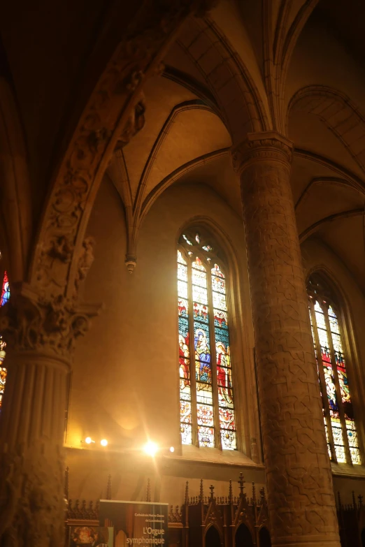 sunlight streaming through windows in a large cathedral