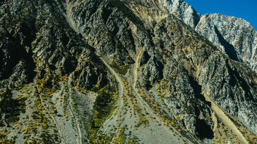 an image of mountains that look like they have moss growing