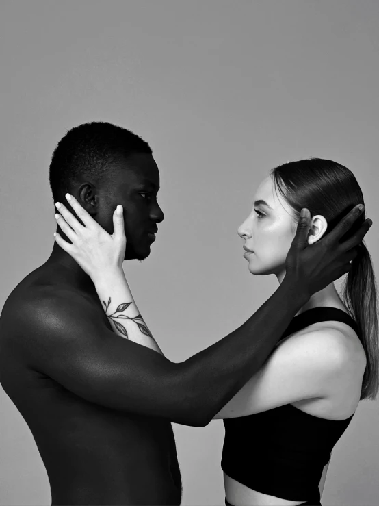 an african american couple touching each other's forehead