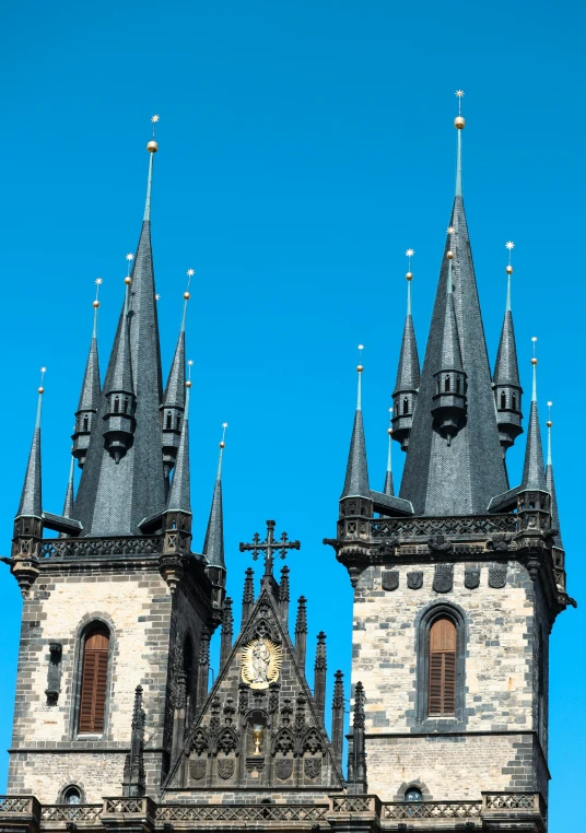 this church tower has a clock displayed on it