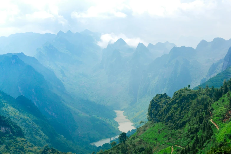 the view of a valley from high up on a mountain