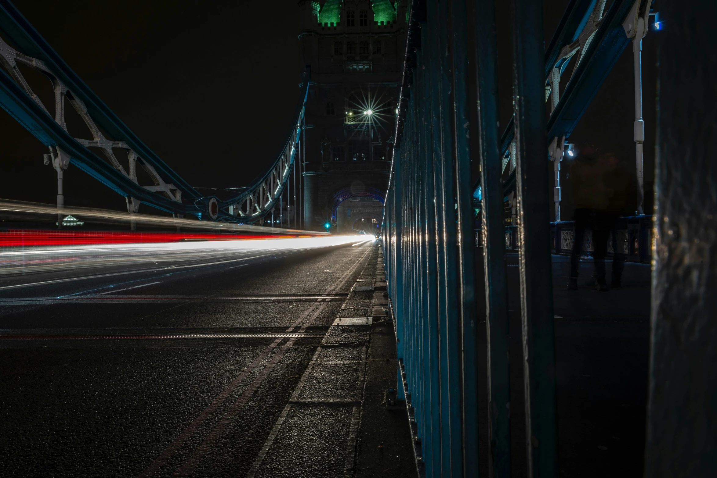 a busy city street lit up with headlights