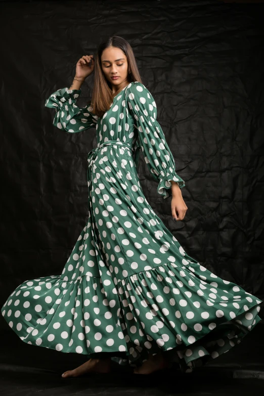 woman in green and white dress with polka dot print