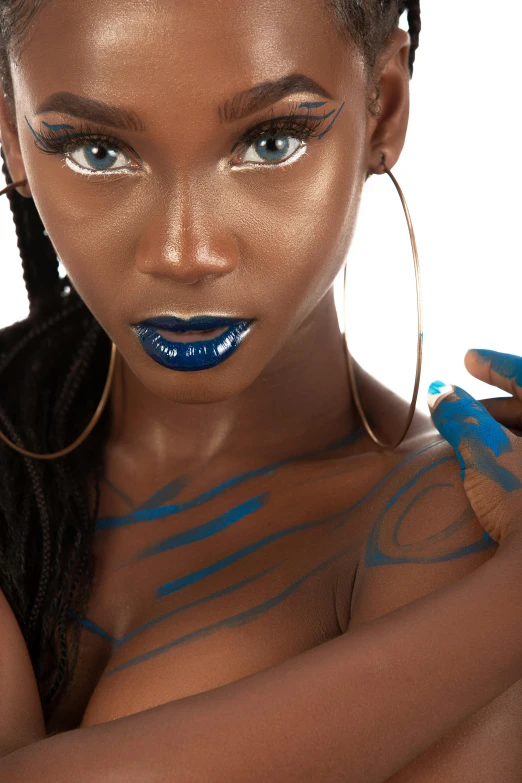 a black woman with blue paint on her body