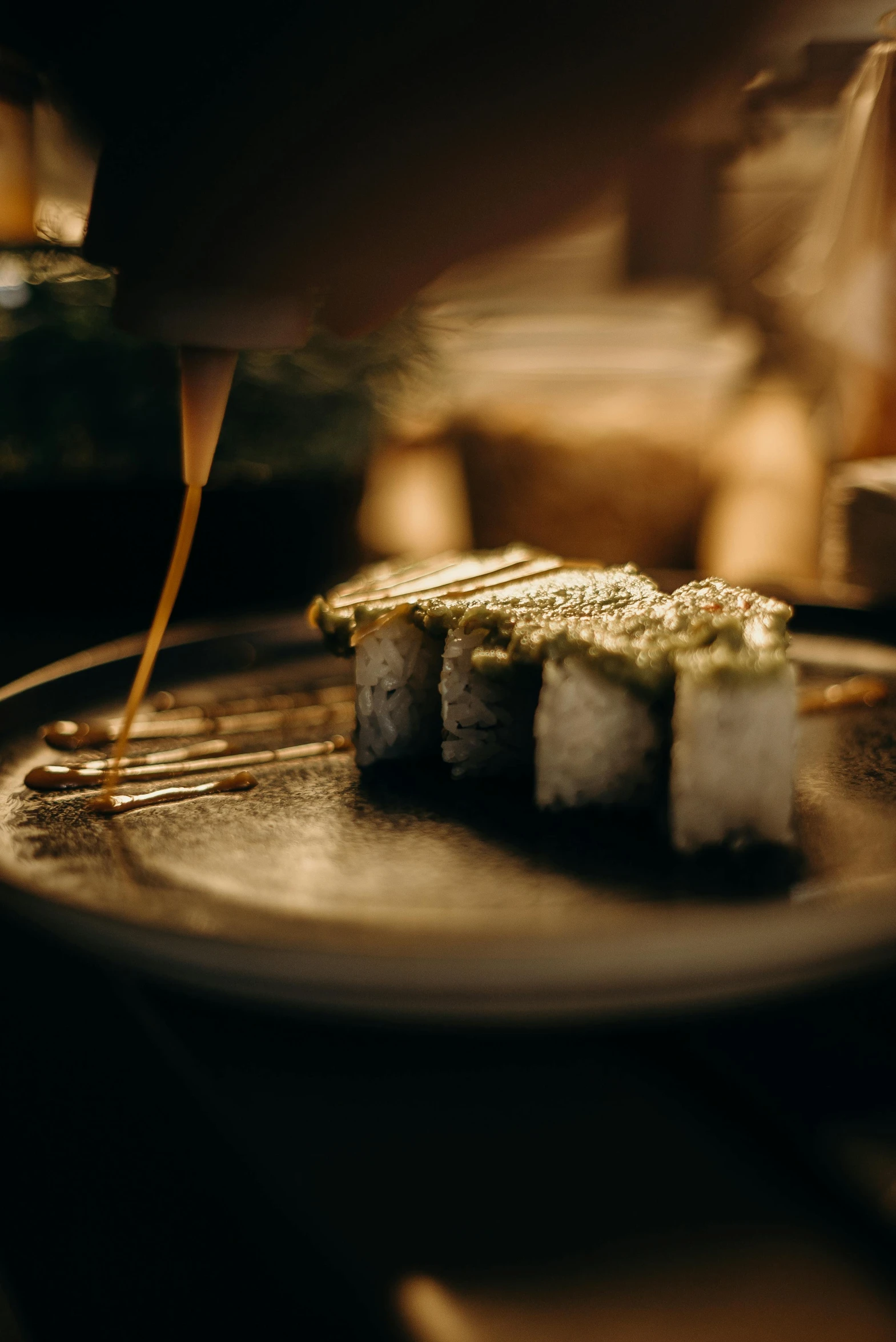 food being made with chopsticks being held to the plate