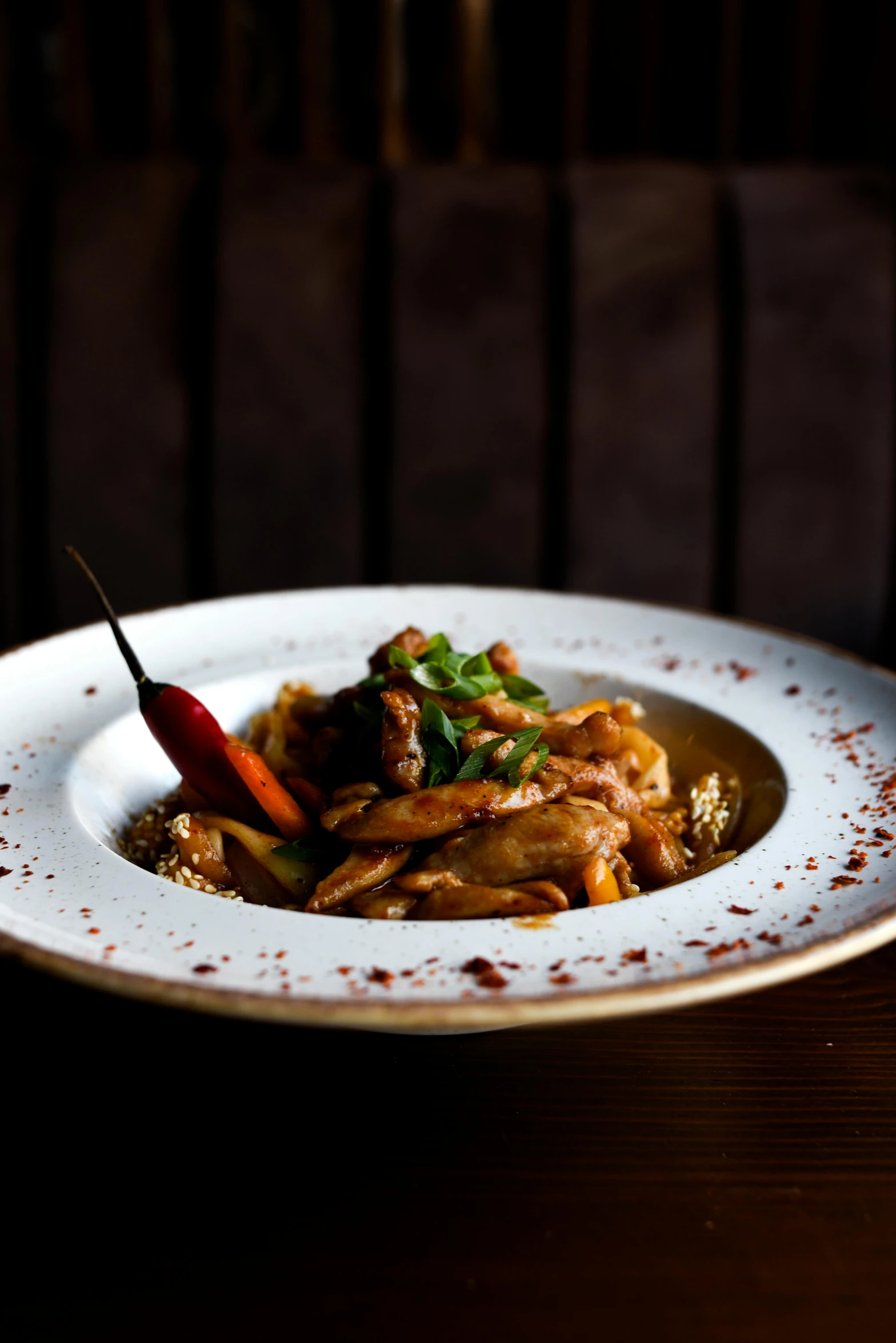 a white plate filled with food and a small chili