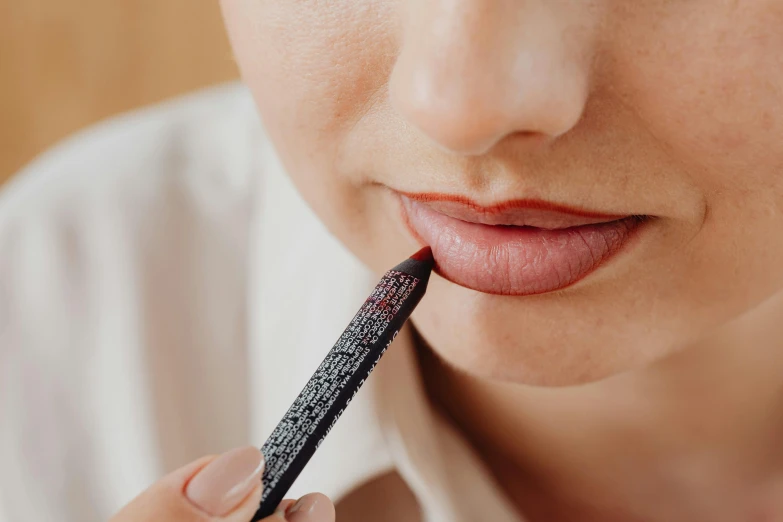 a woman with an unripe lip sticking out of her mouth