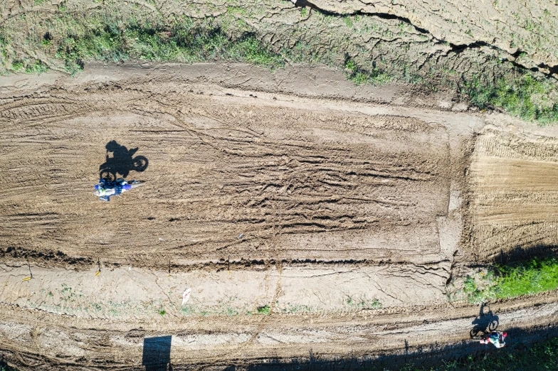 an aerial po shows two motorcyclists riding their bikes