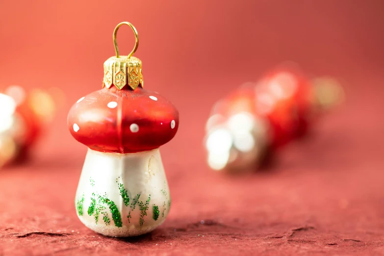 christmas decorations on top of a red surface