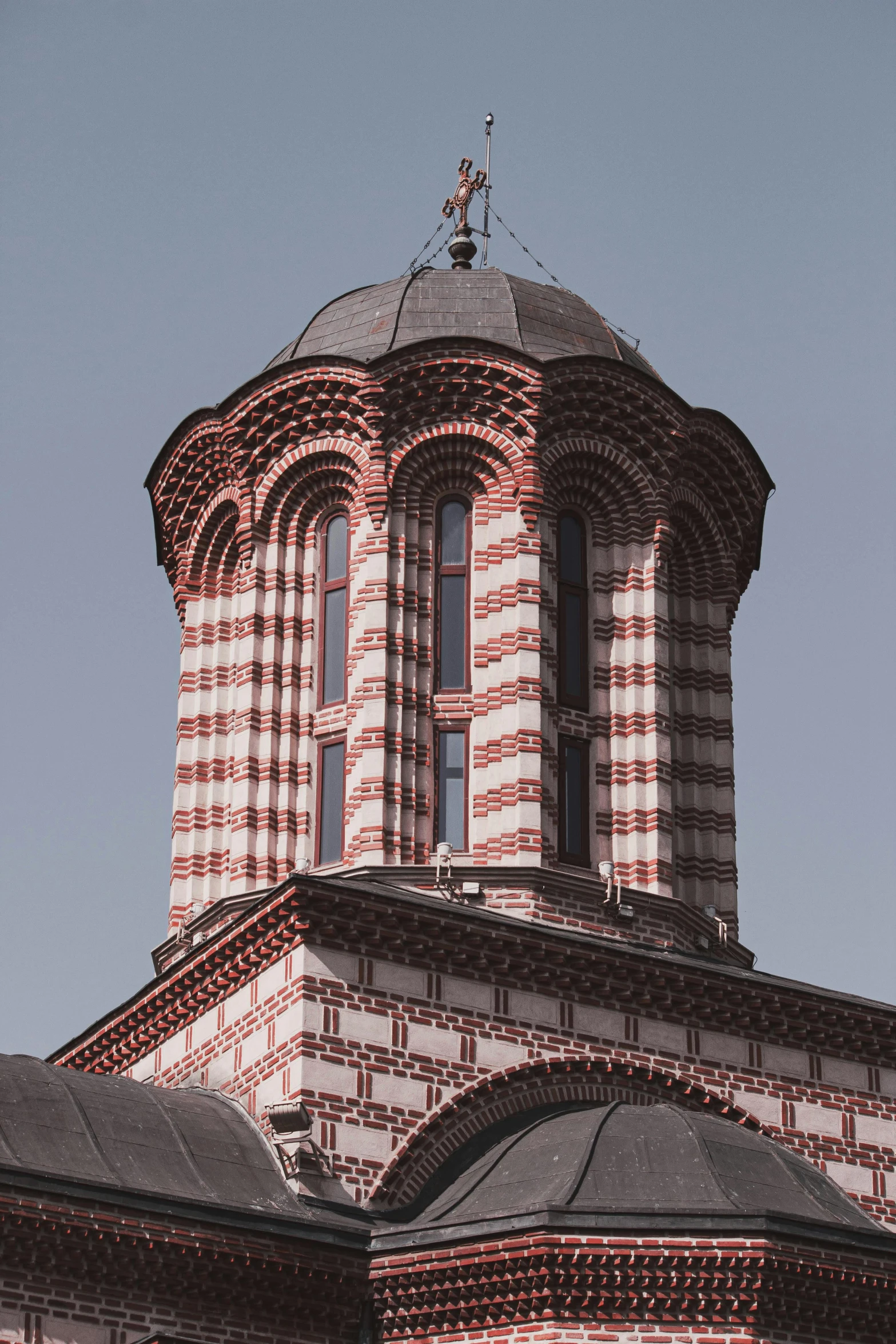 an orange and white building with a large round tower