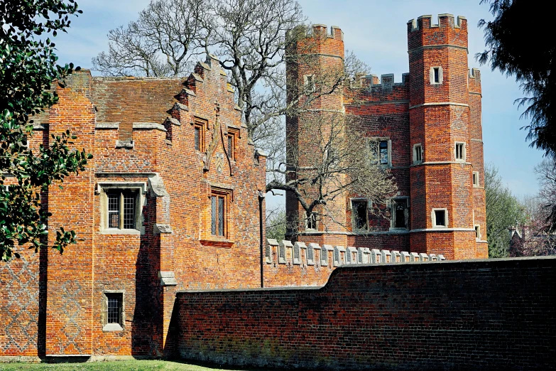 a brick building with a gate next to it